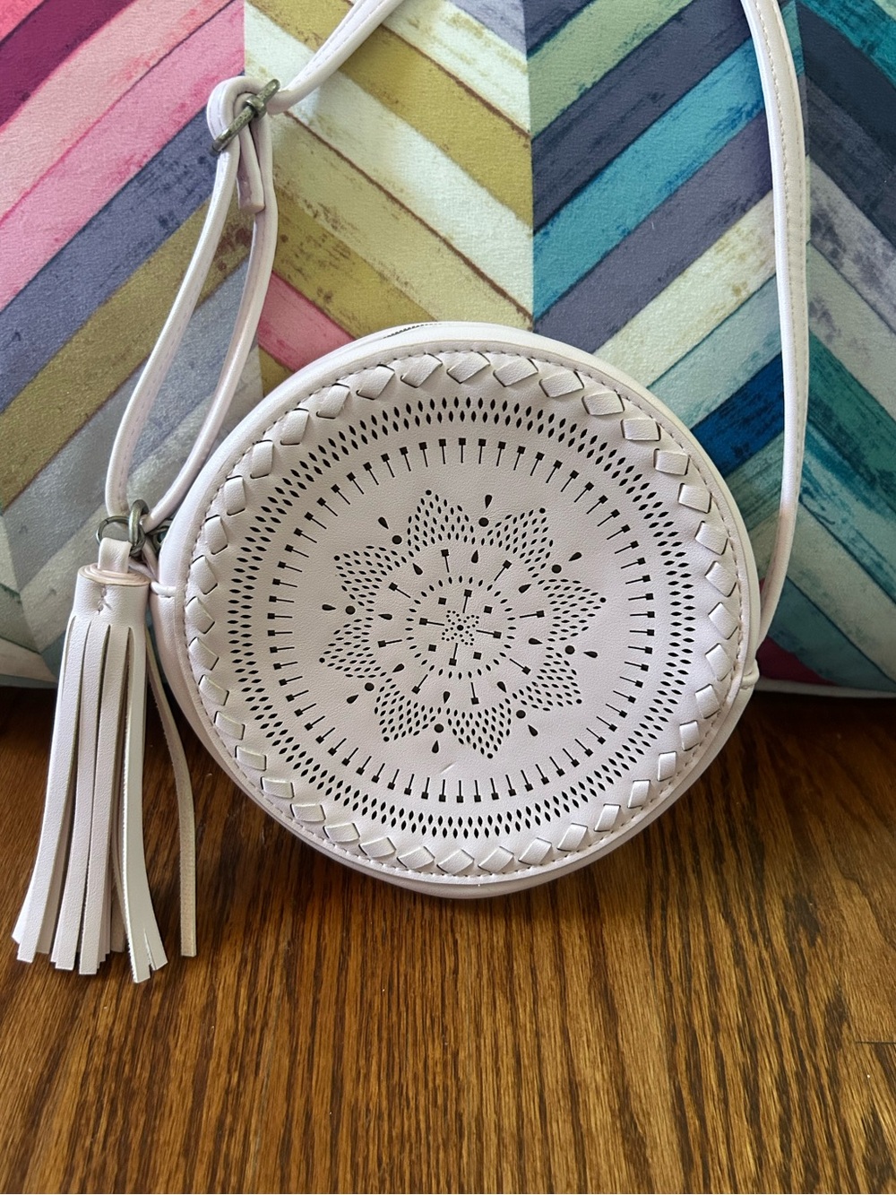 Round White Laser-Cut Crossbody Bag with Tassel